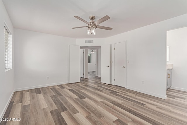 5721 W Palo Verde Ave, Glendale, AZ 85302 - empty room with a ceiling fan, light wood finished floors, and baseboards