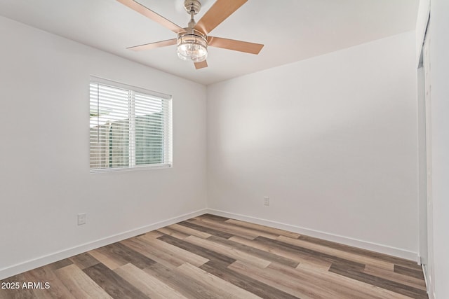 5721 W Palo Verde Ave, Glendale, AZ 85302 - unfurnished room with wood finished floors, baseboards, and ceiling fan
