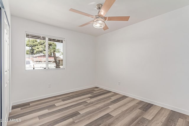 5721 W Palo Verde Ave, Glendale, AZ 85302 - spare room with a ceiling fan, light wood-type flooring, and baseboards