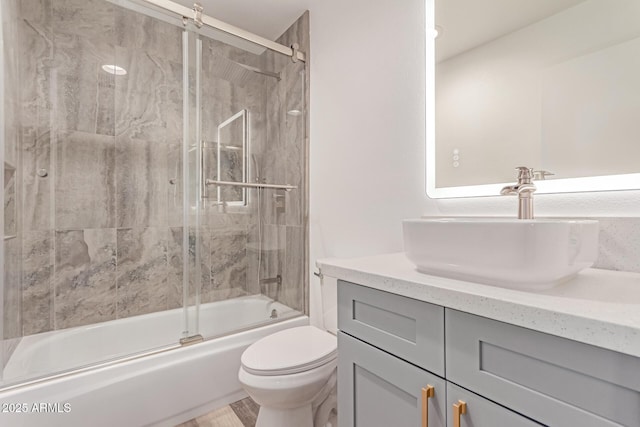 5721 W Palo Verde Ave, Glendale, AZ 85302 - bathroom with vanity, bath / shower combo with glass door, and toilet