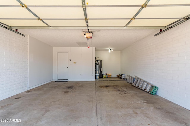 5721 W Palo Verde Ave, Glendale, AZ 85302 - garage featuring a garage door opener and gas water heater