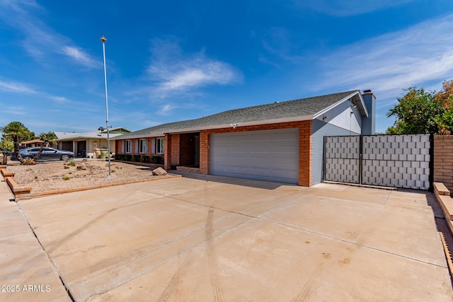 5721 W Palo Verde Ave, Glendale, AZ 85302 - ranch-style house with driveway, an attached garage, brick siding, and roof with shingles