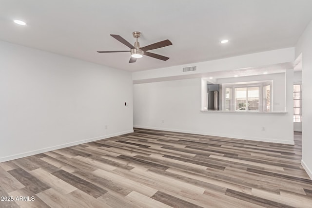 5721 W Palo Verde Ave, Glendale, AZ 85302 - spare room featuring wood finished floors, ceiling fan, baseboards, and recessed lighting