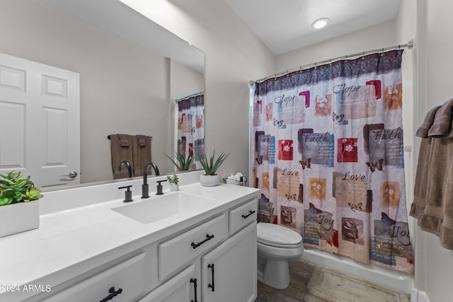 full bathroom featuring shower / tub combo with curtain, vanity, and toilet