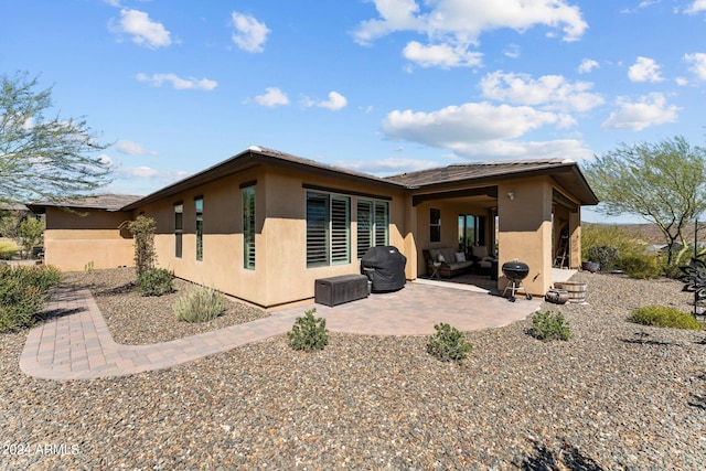 rear view of property with a patio area