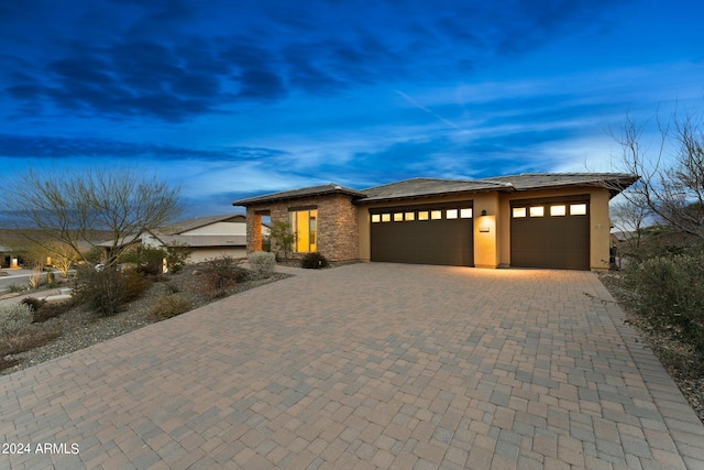 prairie-style home featuring a garage