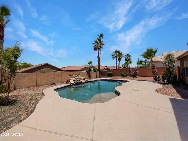 view of swimming pool with a patio area