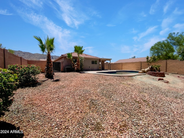 view of yard with a patio and a fenced in pool