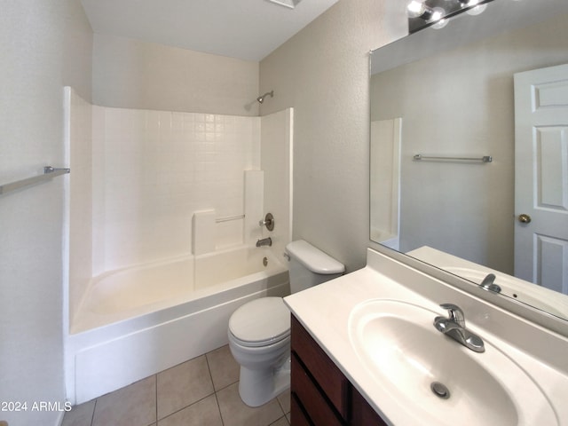 full bathroom featuring washtub / shower combination, tile flooring, vanity with extensive cabinet space, and toilet