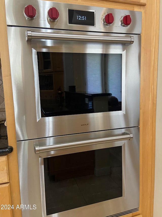 interior details featuring stainless steel double oven