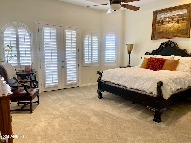 bedroom with access to exterior, ceiling fan, french doors, and light colored carpet