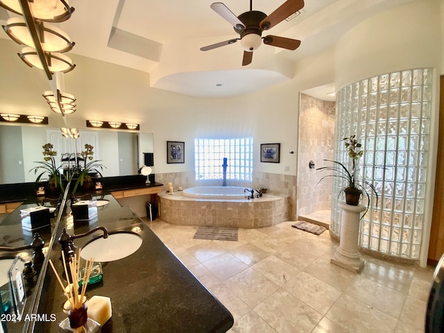 bathroom featuring tile patterned floors, vanity, ceiling fan, and shower with separate bathtub