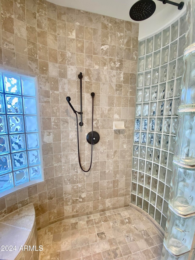 bathroom with tiled shower