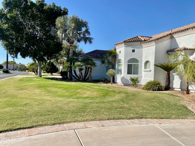 view of home's exterior featuring a lawn