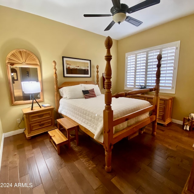 bedroom with ceiling fan and dark wood-type flooring