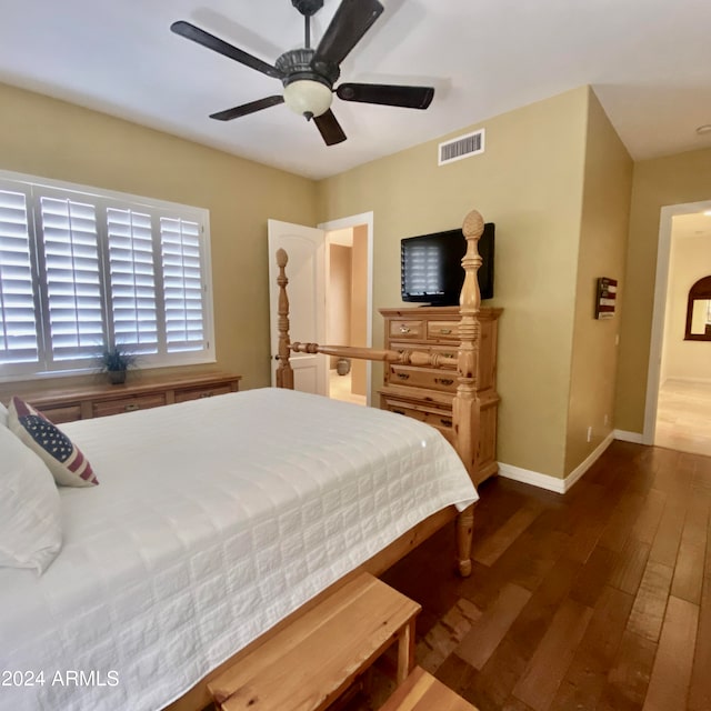 bedroom featuring ceiling fan and dark hardwood / wood-style flooring