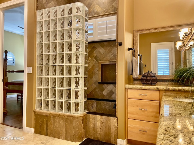 bathroom with a shower and hardwood / wood-style floors