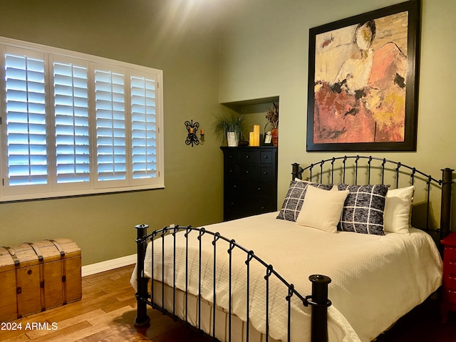 bedroom featuring wood-type flooring