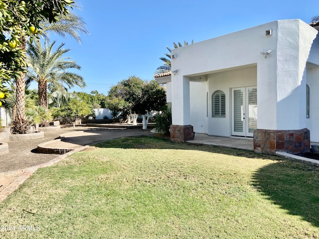 view of yard with french doors