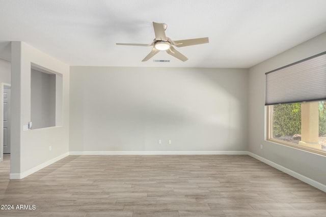 15631 W Bethesda Ct, Surprise, AZ 85374 - unfurnished room with visible vents, baseboards, a ceiling fan, and light wood finished floors