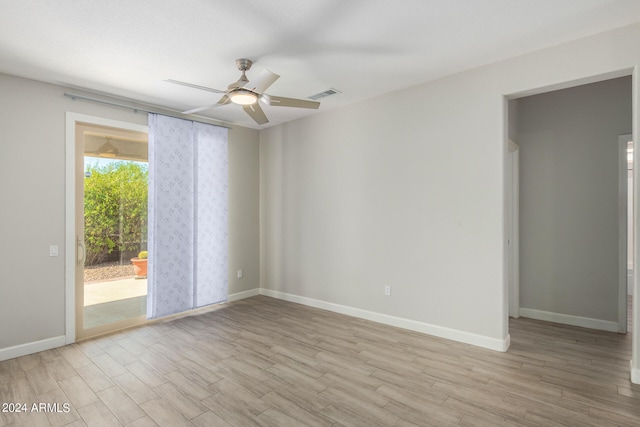 unfurnished room with light wood-type flooring and ceiling fan