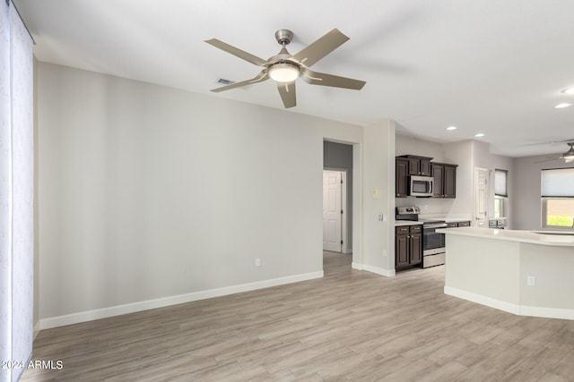 interior space featuring ceiling fan, dark brown cabinets, light hardwood / wood-style flooring, and stainless steel appliances