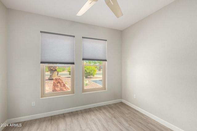 spare room with ceiling fan and light hardwood / wood-style flooring