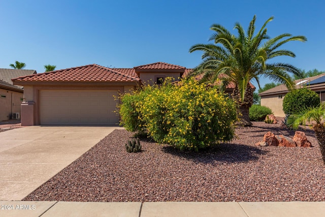 15631 W Bethesda Ct, Surprise, AZ 85374 - mediterranean / spanish-style house with a tile roof, a garage, driveway, and stucco siding