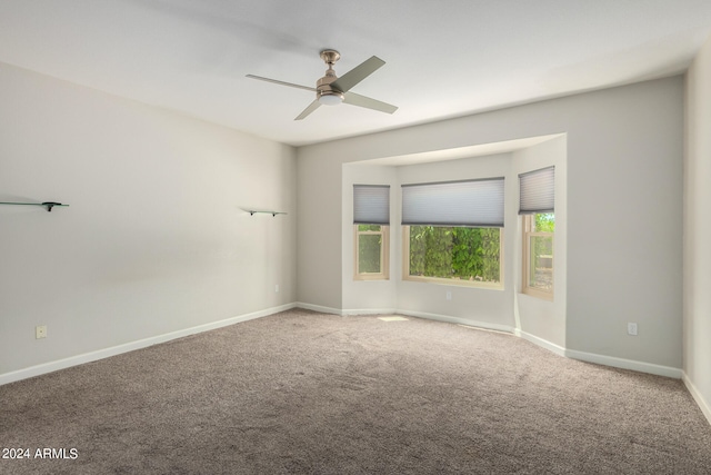 carpeted empty room with ceiling fan