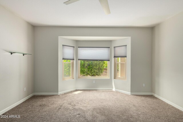 15631 W Bethesda Ct, Surprise, AZ 85374 - carpeted empty room with baseboards and ceiling fan