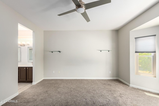 15631 W Bethesda Ct, Surprise, AZ 85374 - empty room featuring baseboards, light colored carpet, and a ceiling fan