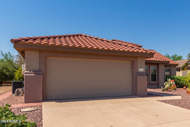 15631 W Bethesda Ct, Surprise, AZ 85374 - mediterranean / spanish-style home with stucco siding, a garage, driveway, and a tiled roof