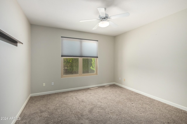 unfurnished room with carpet and ceiling fan