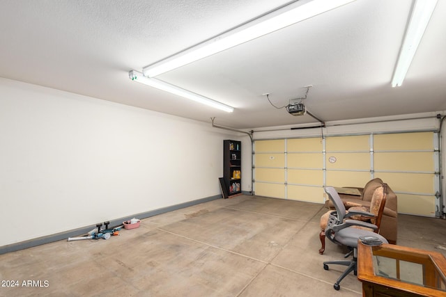 15631 W Bethesda Ct, Surprise, AZ 85374 - garage with a garage door opener and baseboards