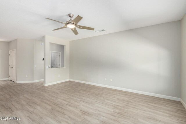 15631 W Bethesda Ct, Surprise, AZ 85374 - spare room featuring visible vents, baseboards, light wood-style flooring, and a ceiling fan