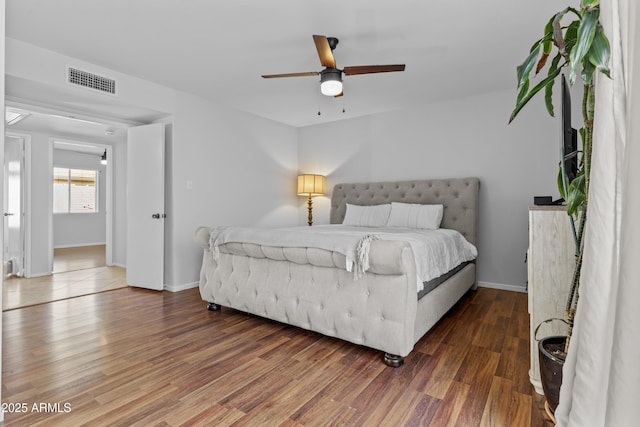 2313 N 87th Way, Scottsdale, AZ 85257 - bedroom featuring wood finished floors, baseboards, and ceiling fan