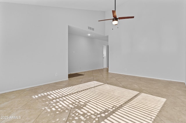 2313 N 87th Way, Scottsdale, AZ 85257 - unfurnished room featuring tile patterned flooring, high vaulted ceiling, a ceiling fan, and baseboards