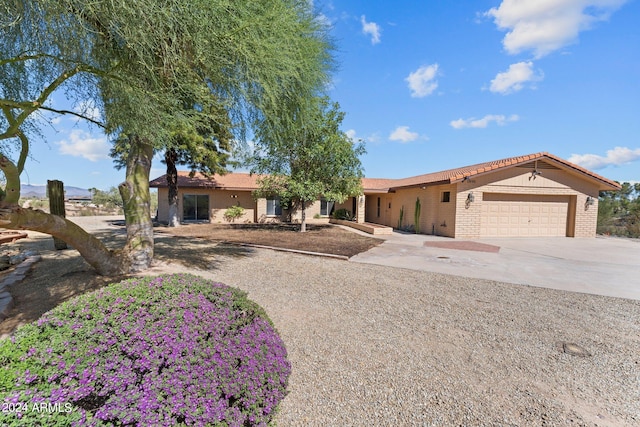 single story home featuring a garage