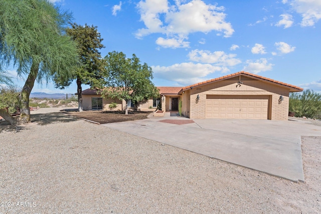 ranch-style home with a garage