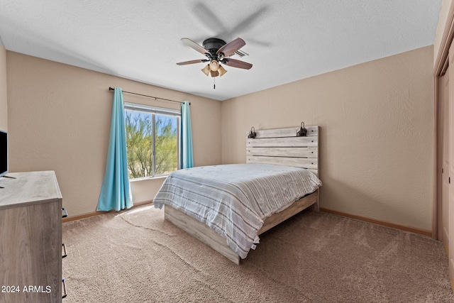 bedroom featuring light carpet, a closet, and ceiling fan