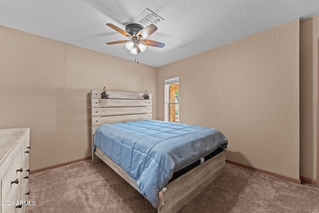 bedroom featuring light carpet and ceiling fan