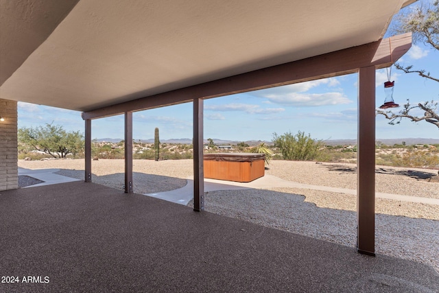 view of patio featuring a hot tub