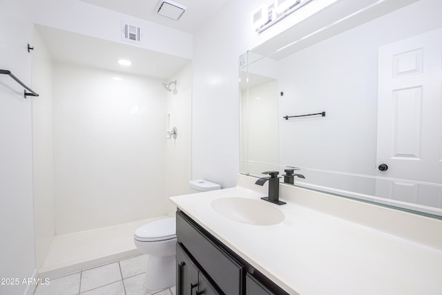 bathroom featuring visible vents, toilet, tile patterned floors, walk in shower, and vanity