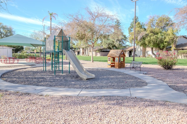 community jungle gym with a yard