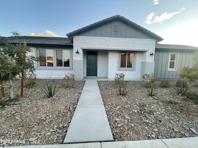 single story home featuring stucco siding