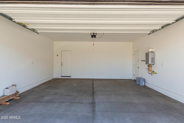 garage featuring a garage door opener, tankless water heater, and baseboards