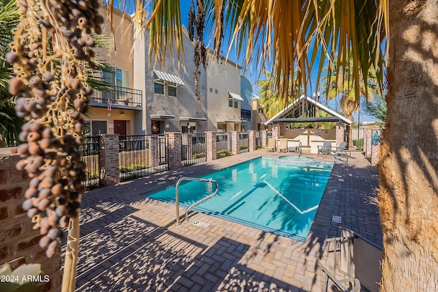 view of pool with a gazebo and a patio