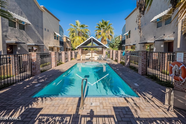 view of pool featuring a gazebo and a patio area