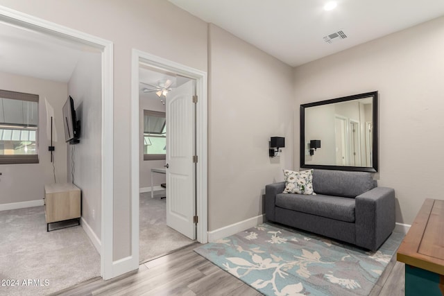 interior space featuring ceiling fan, a healthy amount of sunlight, and light hardwood / wood-style floors