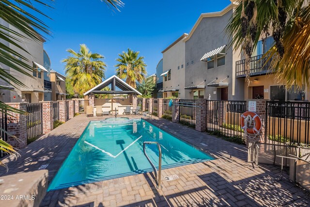 view of swimming pool with a patio